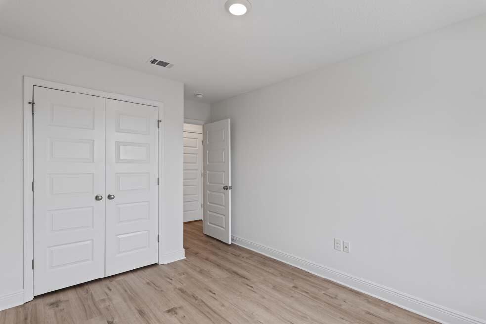 37 Phoenix Street Santa Rosa Beach, FL 32459 - Photo 17 of 26 a view of an empty room and wooden floor