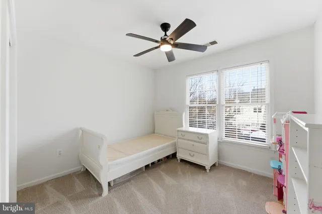a view of a livingroom with furniture and a workspace
