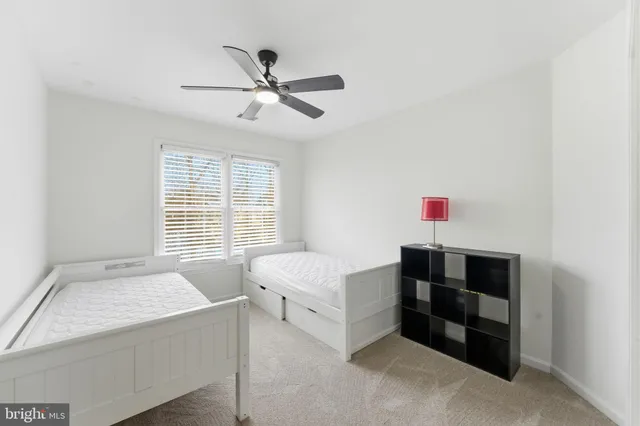 a bedroom with a bed and a lamp