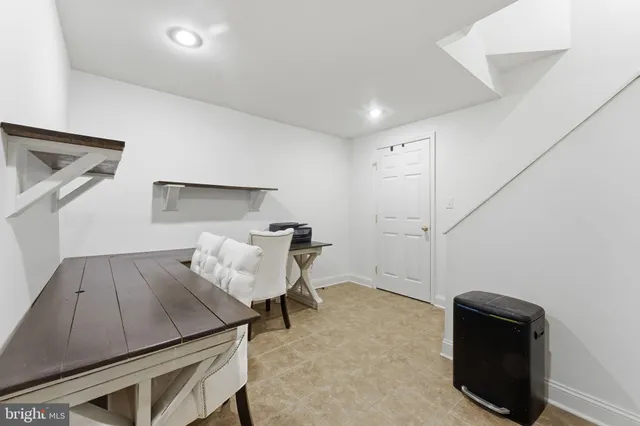 a view of a patio with a table and chairs