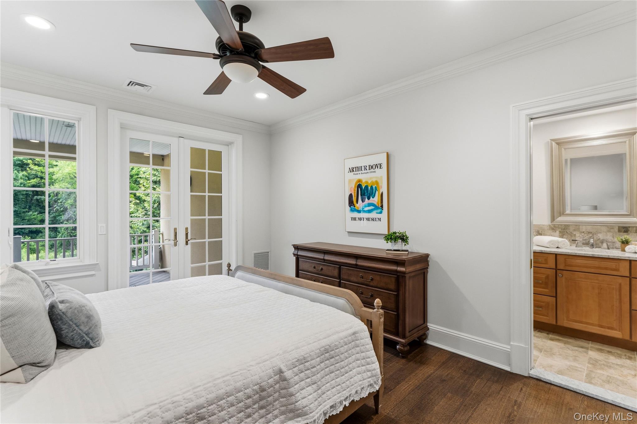 1960 Midlane Road South Syosset, NY 11791 - Photo 34 of 46 a bedroom with a bed and wooden floor