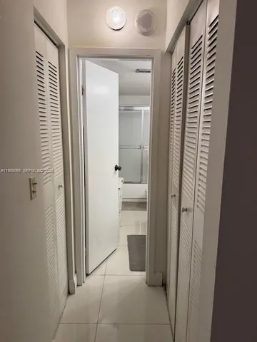 a bathroom with a shower and a sink
