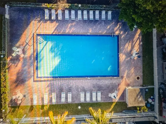 a view of swimming pool with a yard