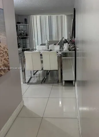 a view of table and chairs in room