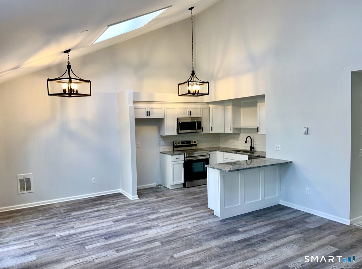 274 Cliffside Drive, Unit 274 Torrington, CT 06790 - Photo 4 of 9 a kitchen with a sink cabinets and window