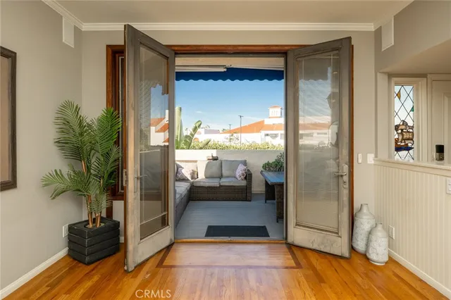 a view of a living room and a balcony
