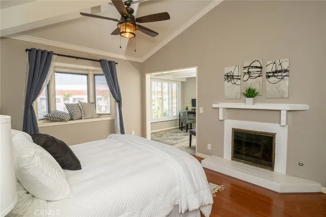 a spacious bedroom with a bed and a fireplace