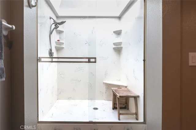 a bathroom with a bathtub and a shower
