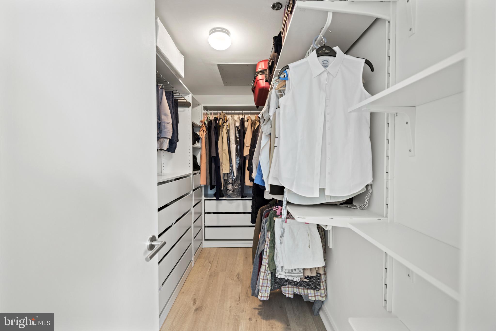1401 Church Street Northwest, Unit 321 Washington, DC 20005 - Photo 14 of 33 a view of walk in closet with clothes and shoes