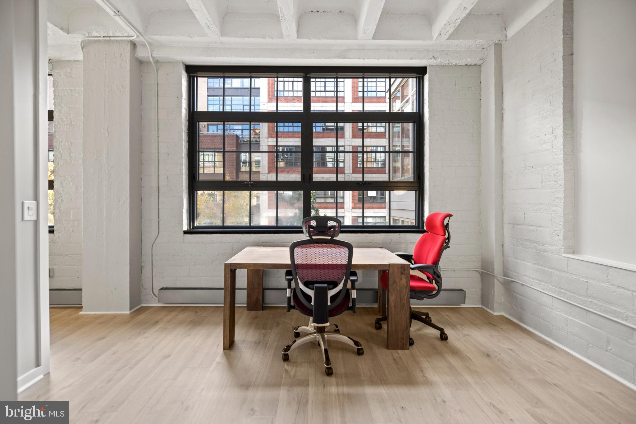 1401 Church Street Northwest, Unit 321 Washington, DC 20005 - Photo 19 of 33 a view of a workspace with furniture and a window