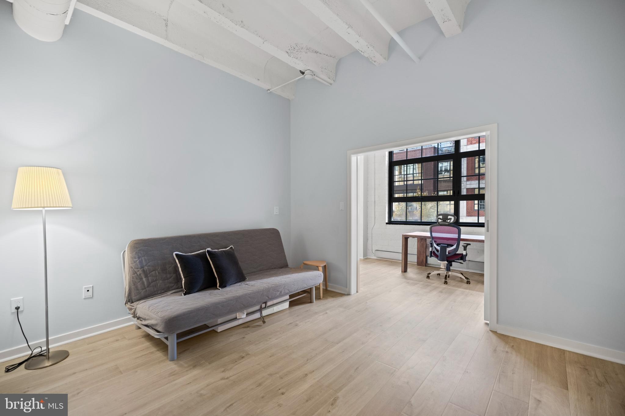 1401 Church Street Northwest, Unit 321 Washington, DC 20005 - Photo 21 of 33 a living room with furniture and a table