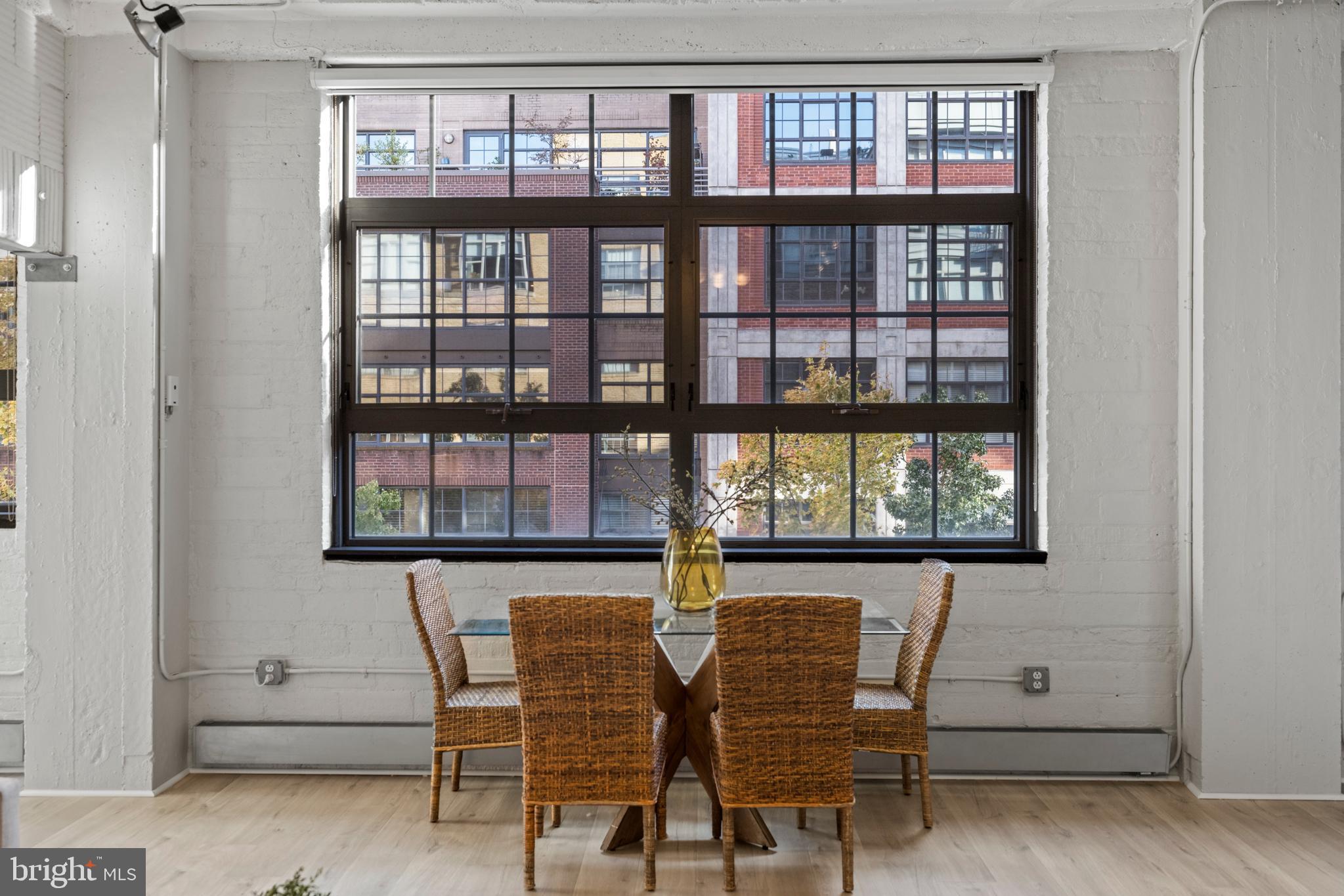 1401 Church Street Northwest, Unit 321 Washington, DC 20005 - Photo 8 of 33 a view of a room that has a table and chairs in it
