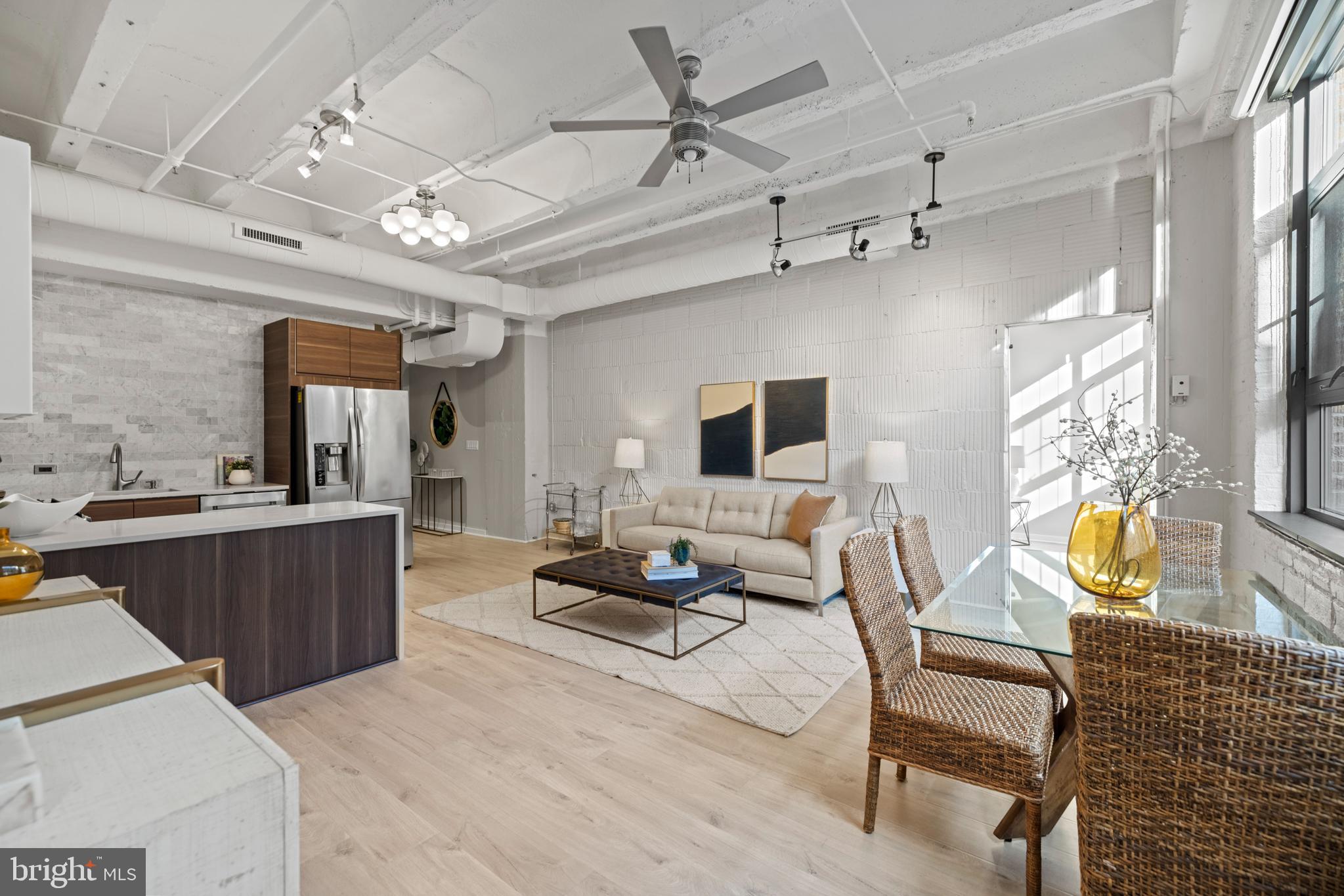 1401 Church Street Northwest, Unit 321 Washington, DC 20005 - Photo 9 of 33 a living room with furniture and wooden floor