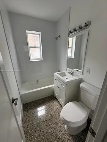 a bathroom with a toilet sink and bathtub