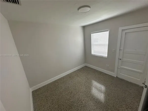 an empty room with a window