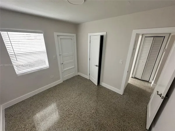 a view of a room that has a window in it