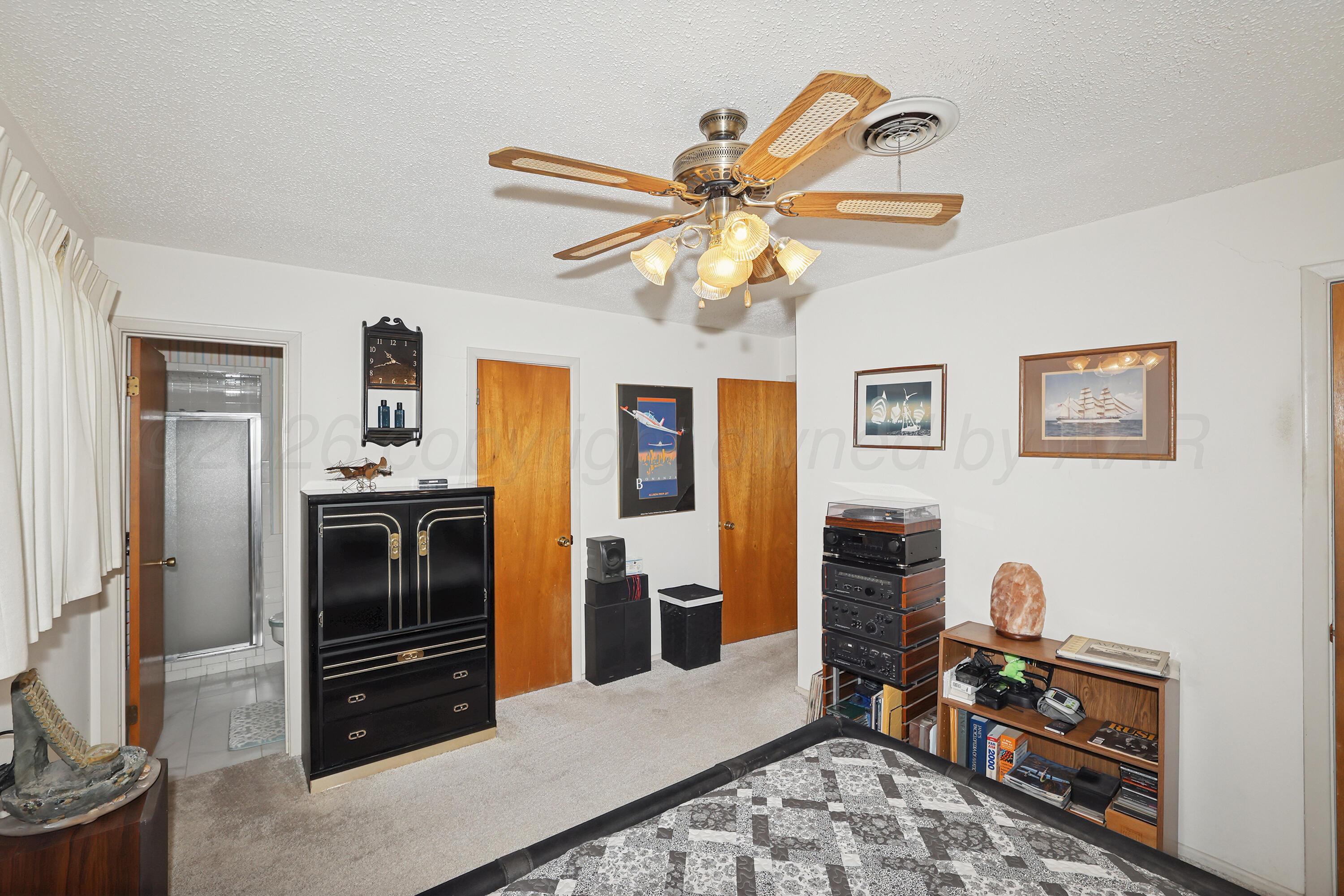 3708 Wayne Street Amarillo, TX 79109 - Photo 17 of 36 a view of a workspace with furniture and a window