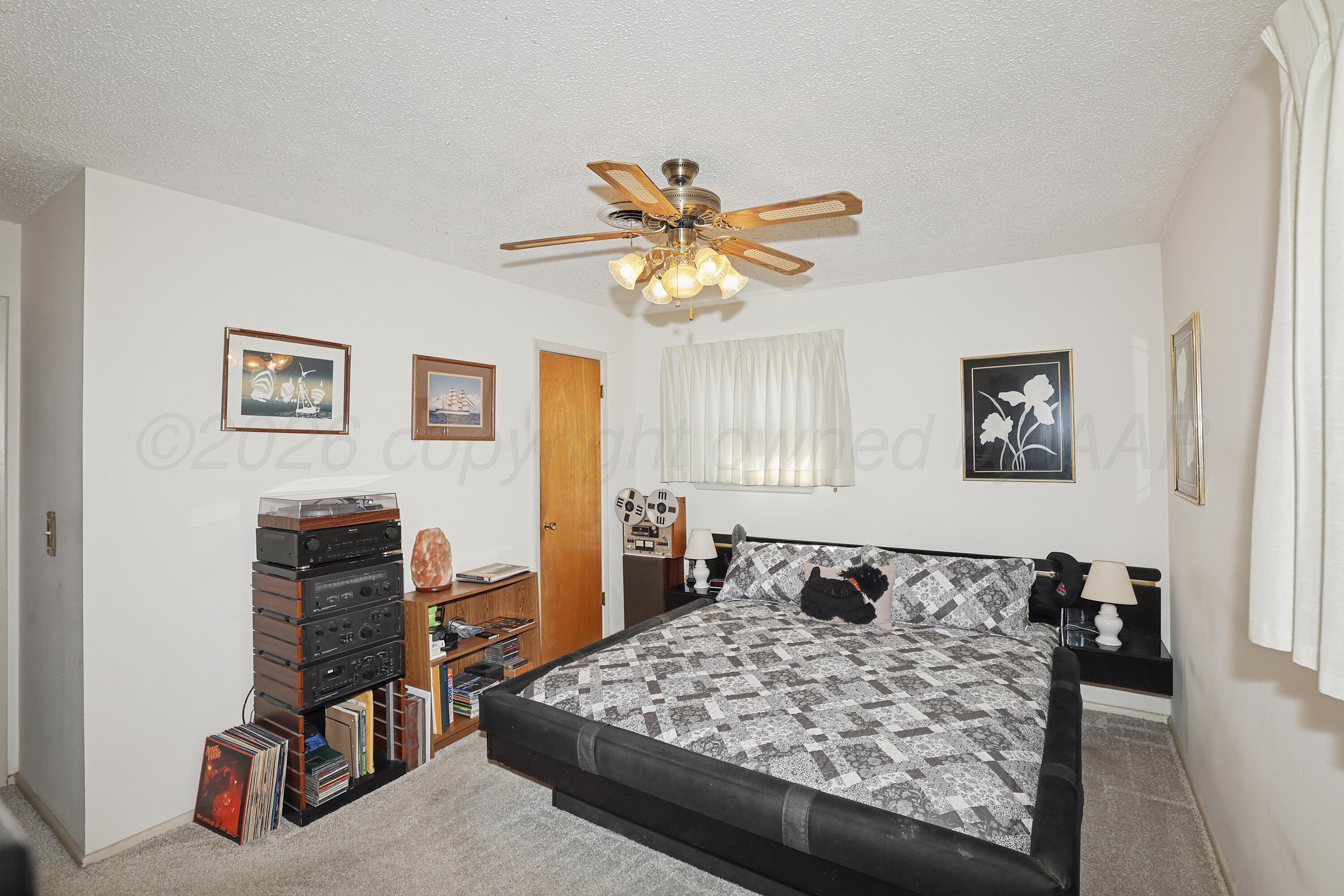 3708 Wayne Street Amarillo, TX 79109 - Photo 18 of 36 a living room with furniture and wooden floor