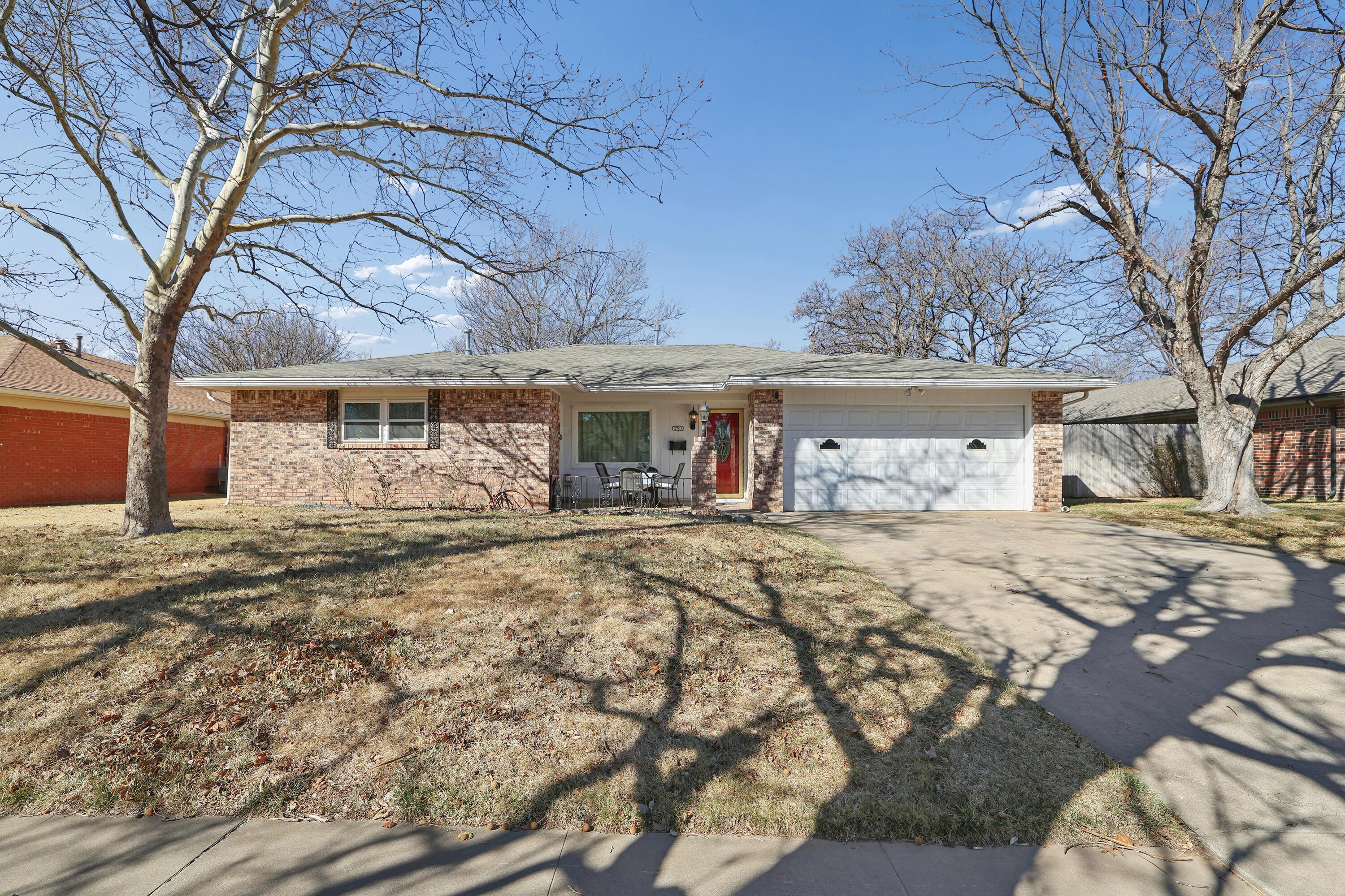 3708 Wayne Street Amarillo, TX 79109 - Photo 2 of 36 a front view of a house with garden