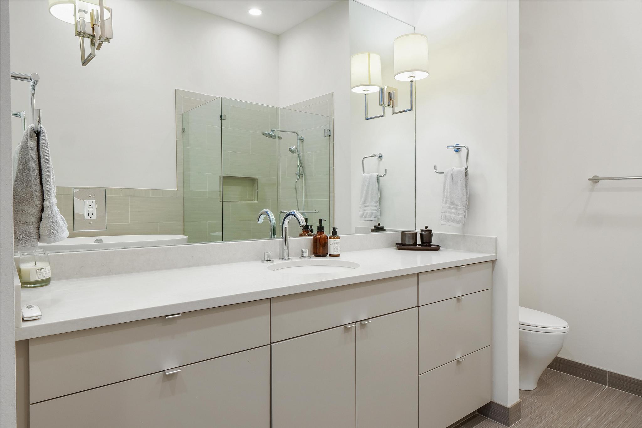 555 East 5th Street, Unit 3022 Austin, TX 78701 - Photo 27 of 40 Bathroom with vanity and a stall shower