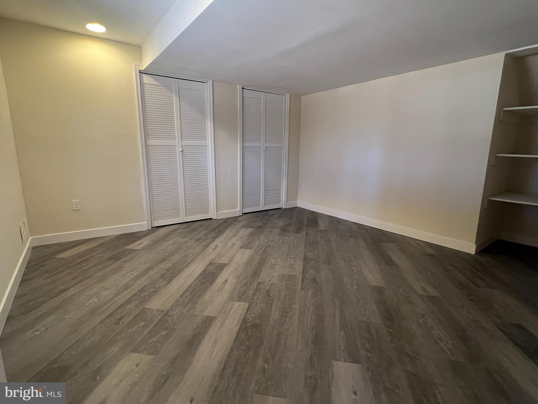 7510 Sanner Road Laurel, MD 20723 - Photo 14 of 26 a view of an empty room with wooden floor and closet