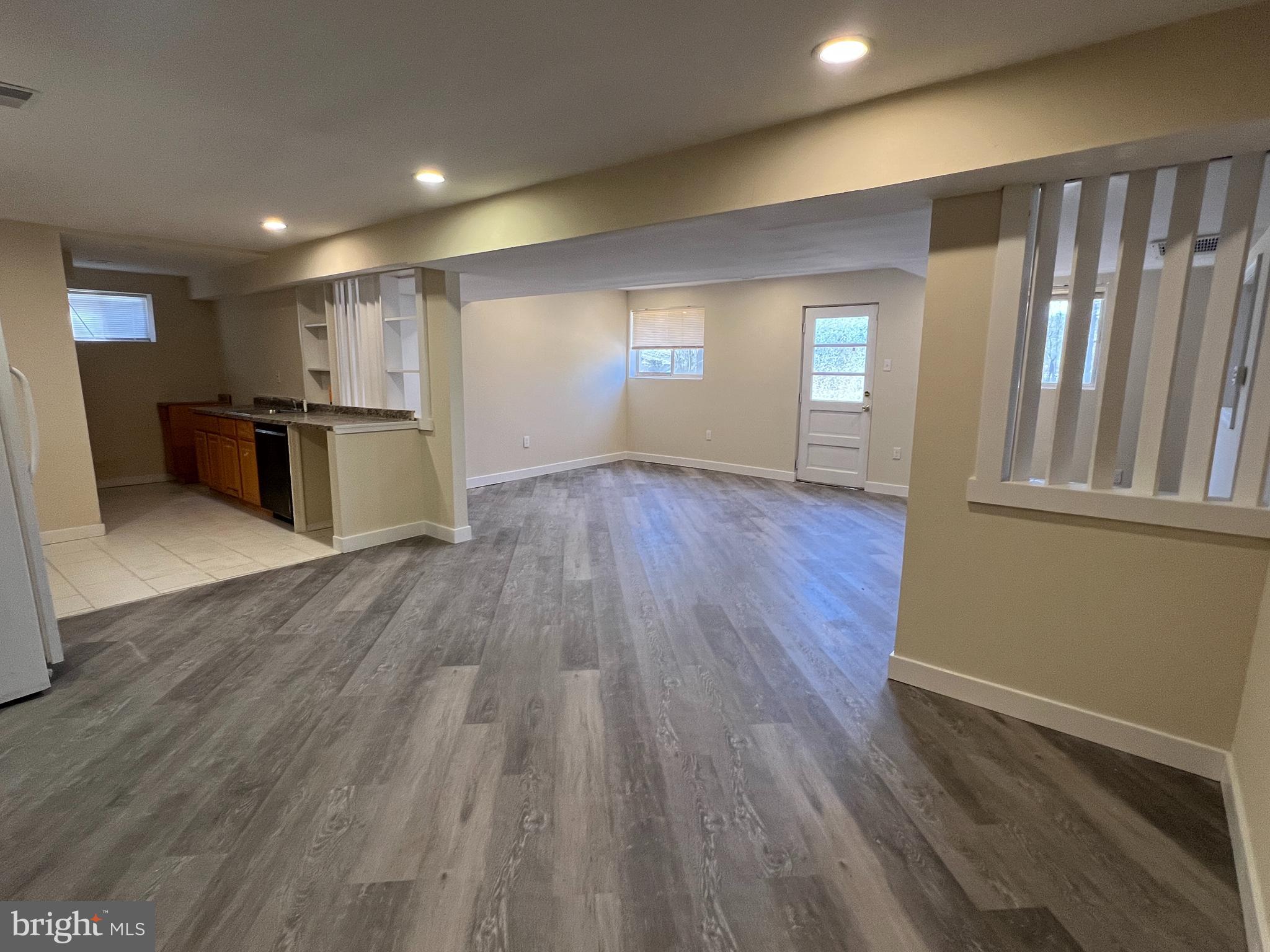 7510 Sanner Road Laurel, MD 20723 - Photo 16 of 26 a view of kitchen with wooden floor and electronic appliances