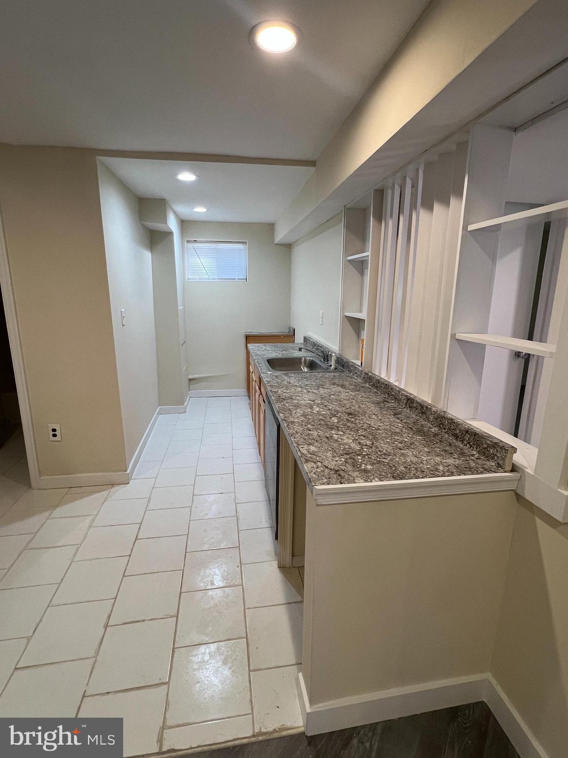 7510 Sanner Road Laurel, MD 20723 - Photo 17 of 26 a view of a kitchen cabinets and wooden floor