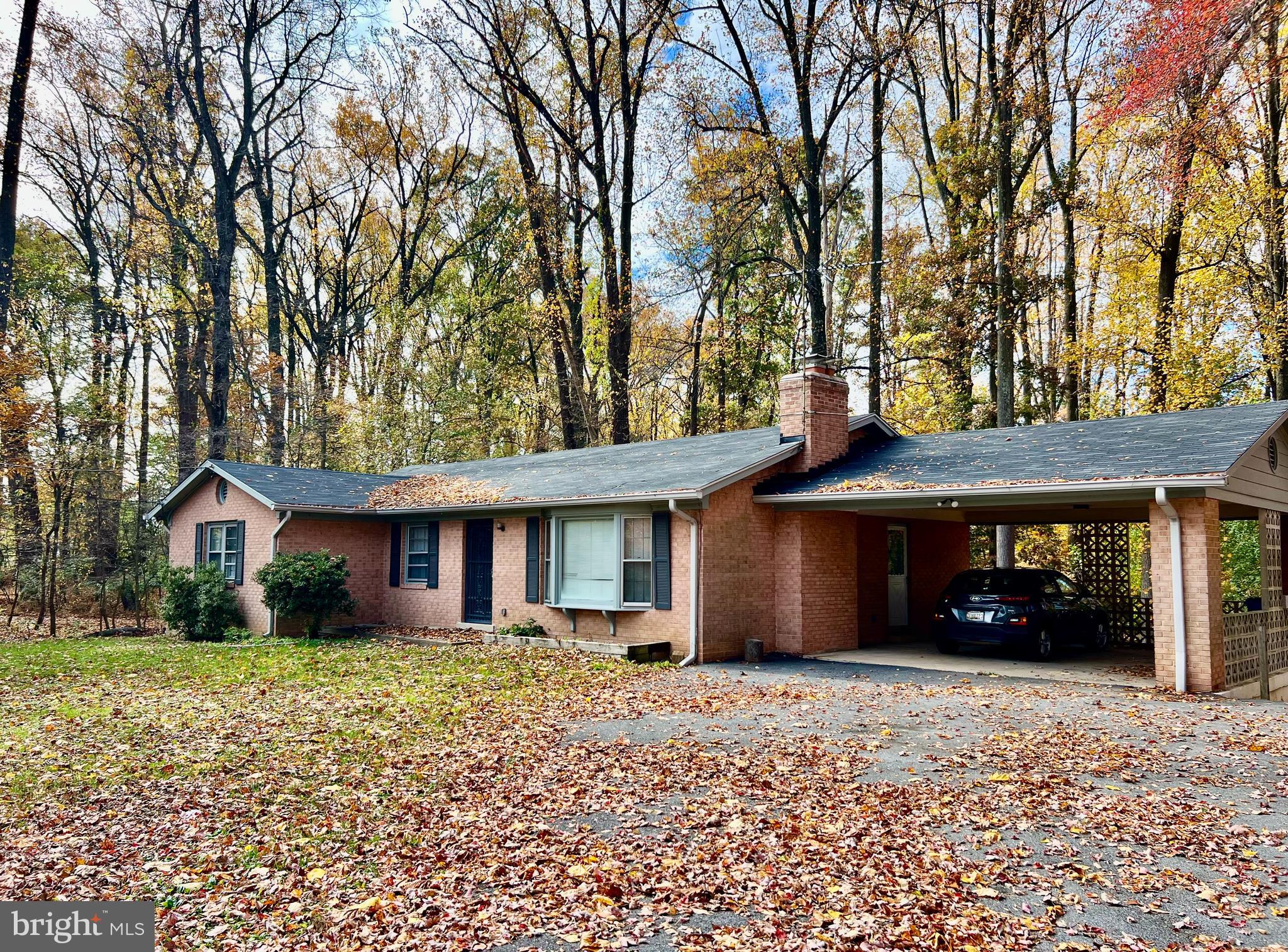 7510 Sanner Road Laurel, MD 20723 - Photo 2 of 26 a front view of a house with a yard