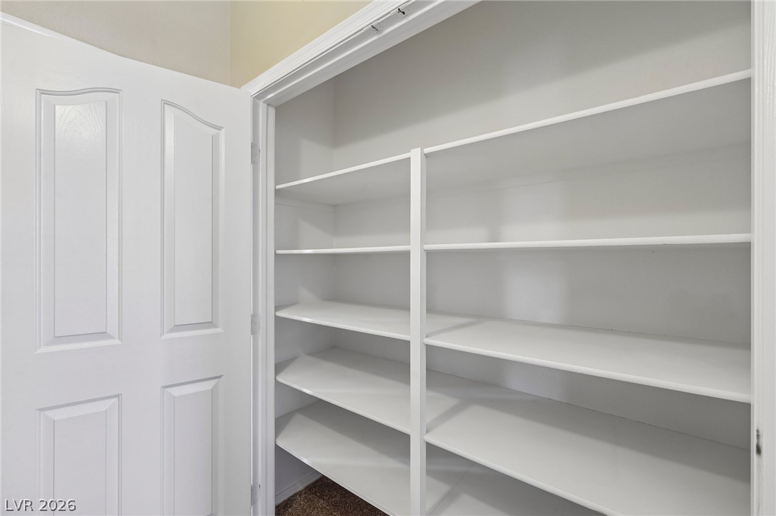 1727 Millstream Way Henderson, NV 89074 - Photo 32 of 46 Streamlined shelving provides ample storage in this well-appointed closet space.