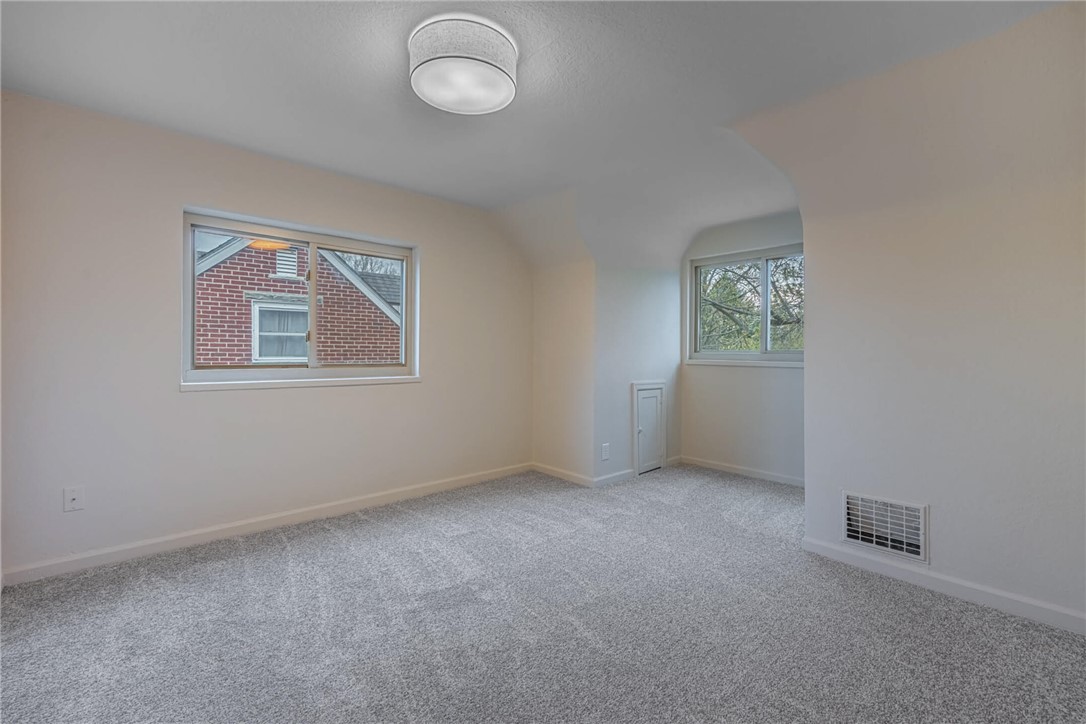 1012 Hampshire Road Dayton, OH 45419 - Photo 29 of 39 This bright and airy room offers soft carpeting and ample natural light through its windows.