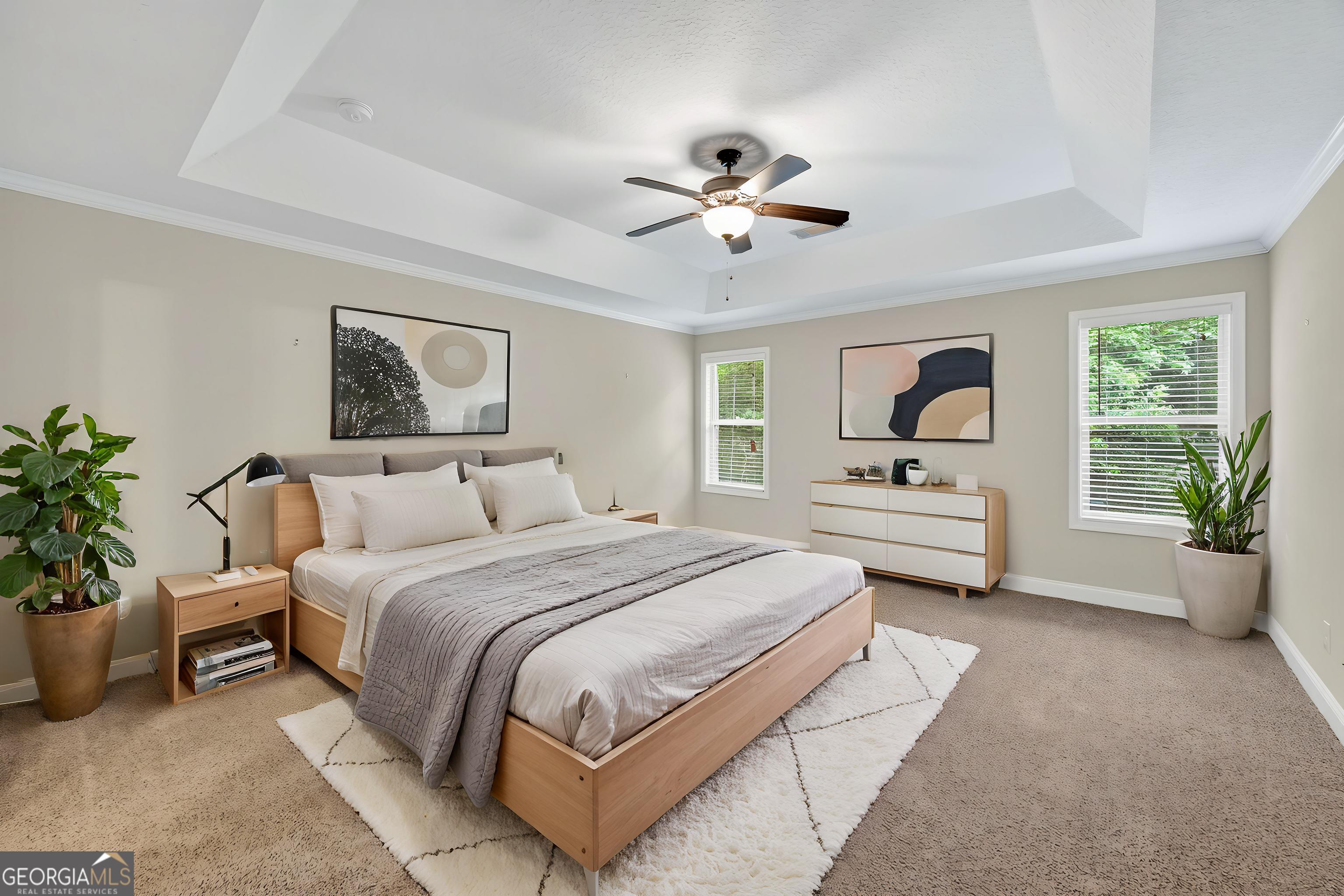 717 Oconee Lane Commerce, GA 30529 - Photo 46 of 57 a spacious bedroom with a bed and a potted plant
