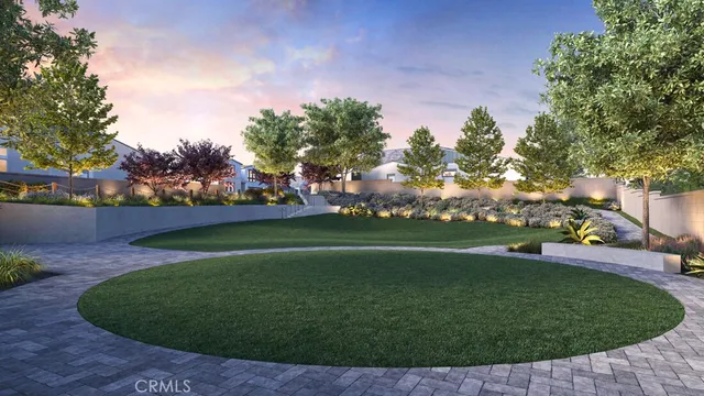 a view of a field of grass and trees