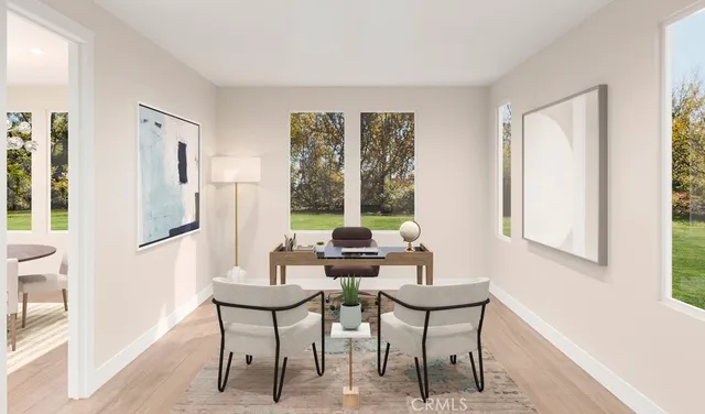 a view of a room with furniture and windows