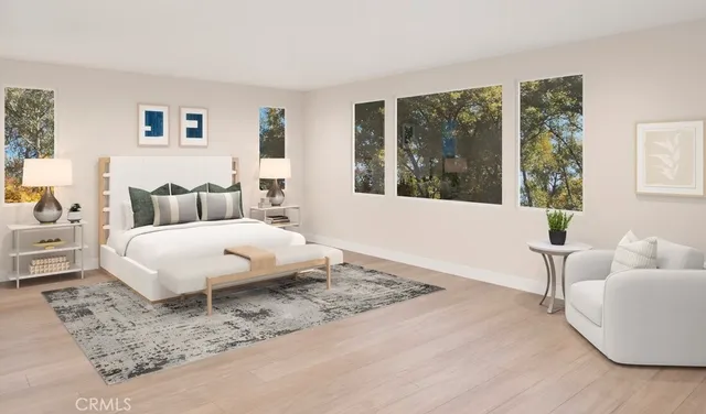 a bedroom with a large bed and a large window