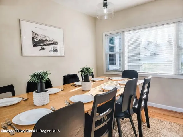 a view of a dining room with furniture window and outside view