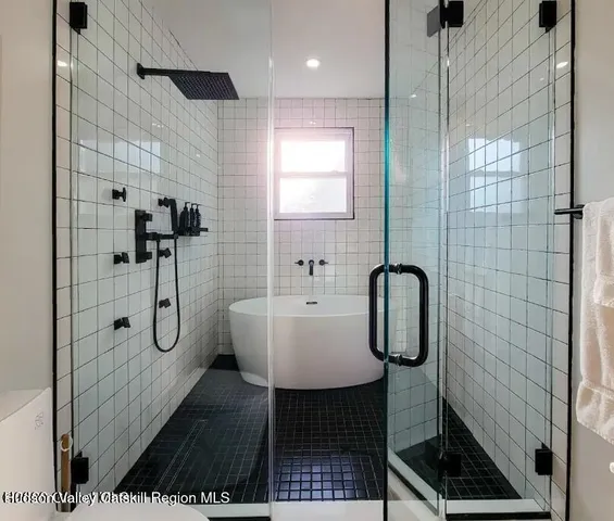 a white bath tub sitting in a bathroom