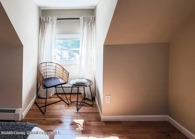 a bedroom with two beds and a window