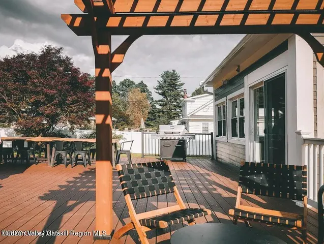 a view of a chairs and table on the deck