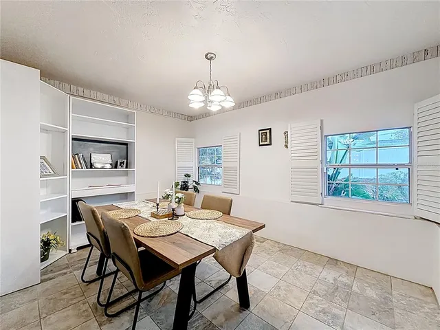 a dining room with wooden floor and breakfast area