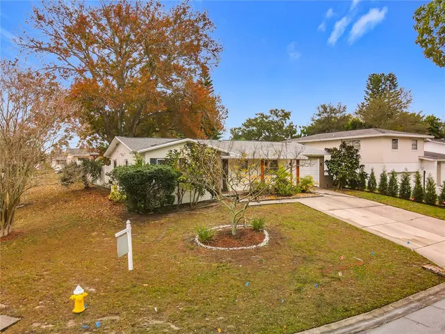 a view of a swimming pool with an outdoor space and seating area