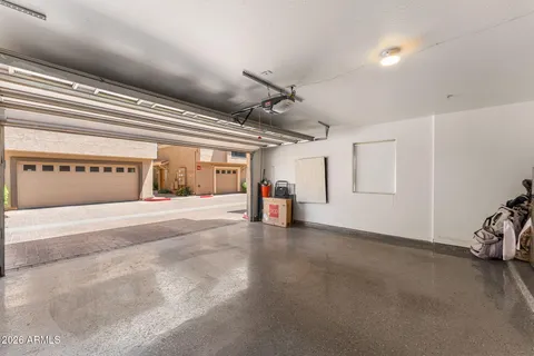 a view of a garage with rack and bicycle