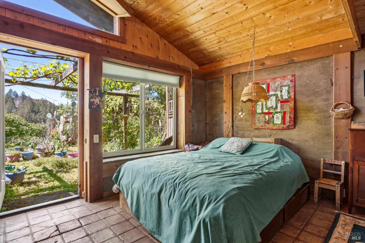 3751 Low Gap Road Ukiah, CA 95482 - Photo 7 of 22 a bedroom with a bed and a large window with outer view
