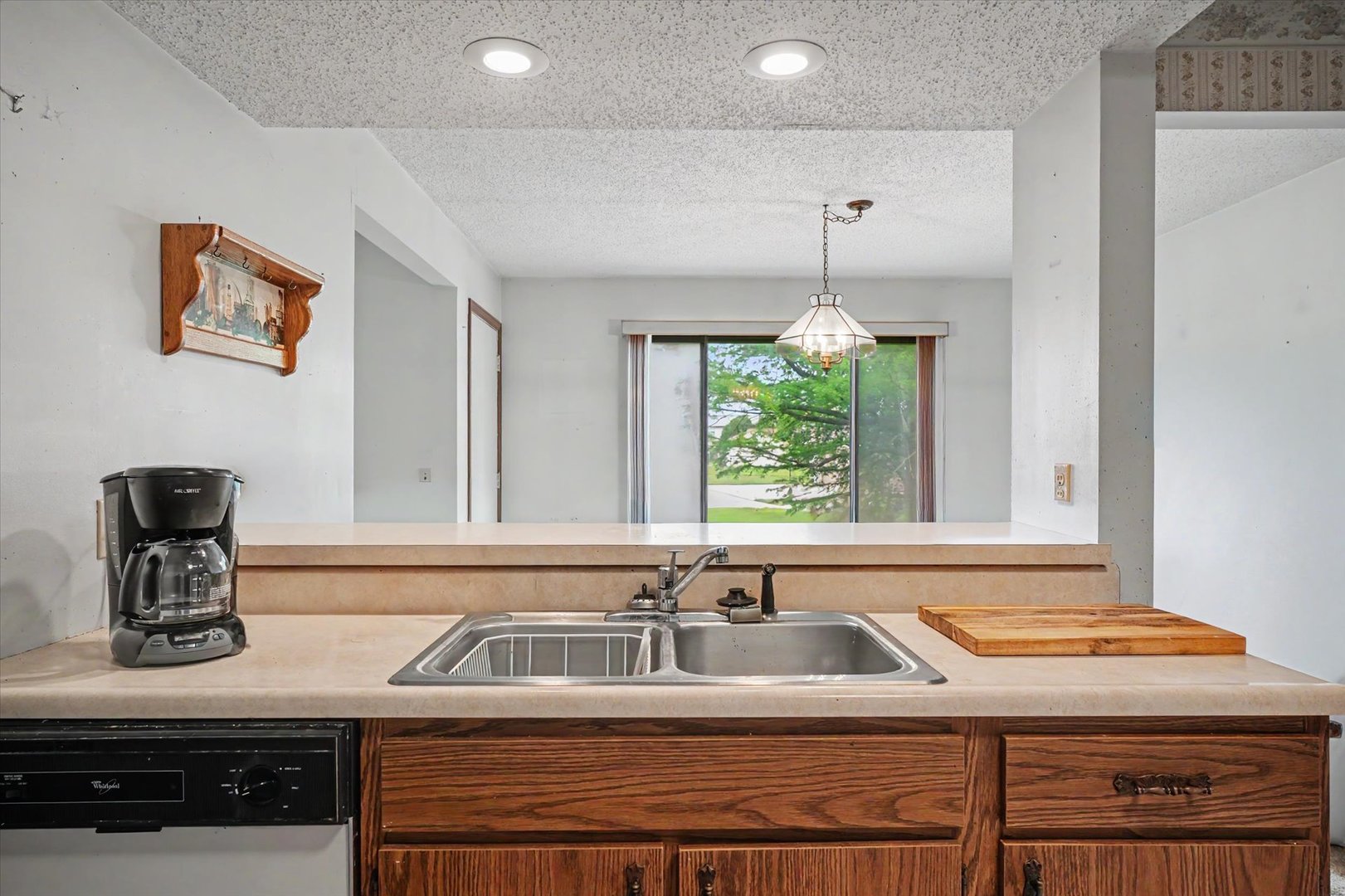 711 Higgins Road Champaign, IL 61822 - Photo 8 of 23 a kitchen with a sink cabinets and window
