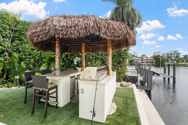 a view of a swimming pool with lawn chairs