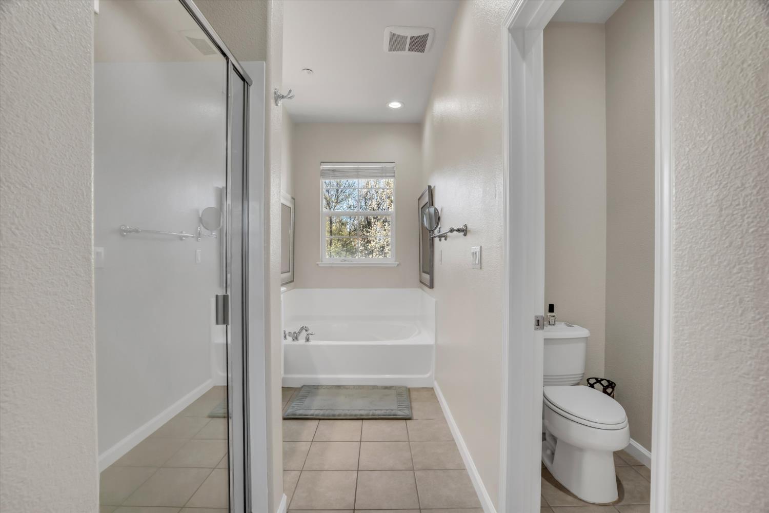 62 South Rio Rapido Drive Tracy, CA 95391 - Photo 26 of 40 a bathroom with a granite countertop bathtub shower sink and toilet