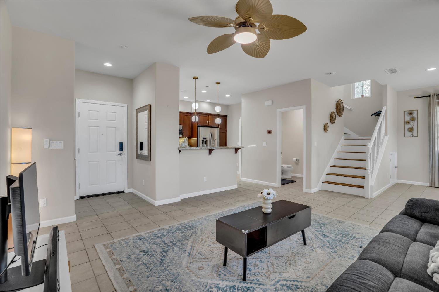 62 South Rio Rapido Drive Tracy, CA 95391 - Photo 10 of 40 a living room with furniture and a chandelier