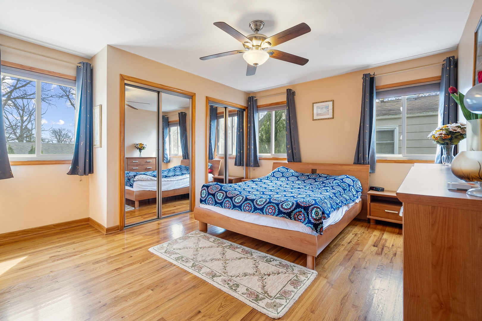 4301 Euclid Avenue Rolling Meadows, IL 60008 - Photo 12 of 30 a bedroom with a large bed a flat tv screen and dresser