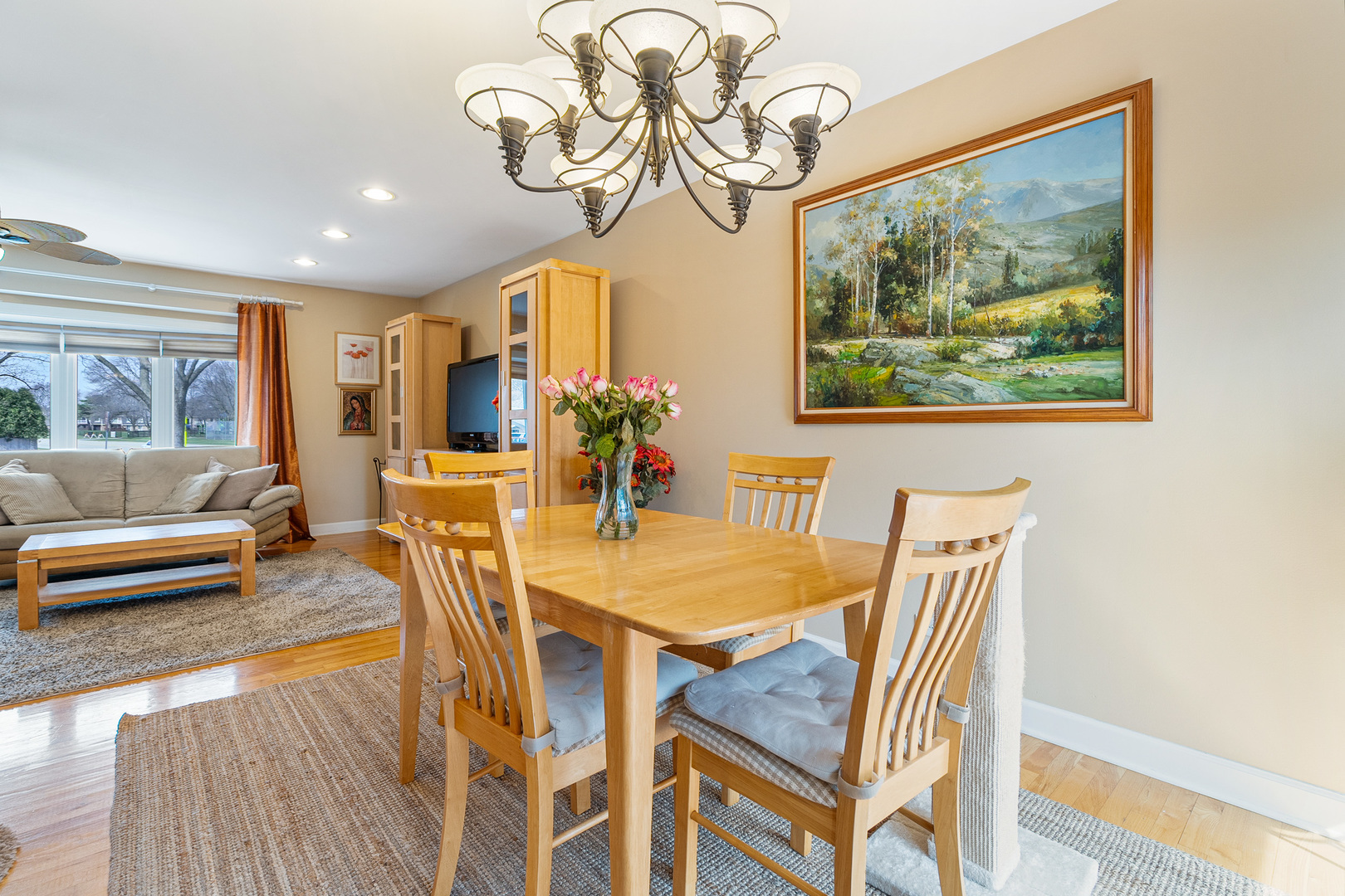 4301 Euclid Avenue Rolling Meadows, IL 60008 - Photo 19 of 30 a view of a dining room with furniture a chandelier and wooden floor