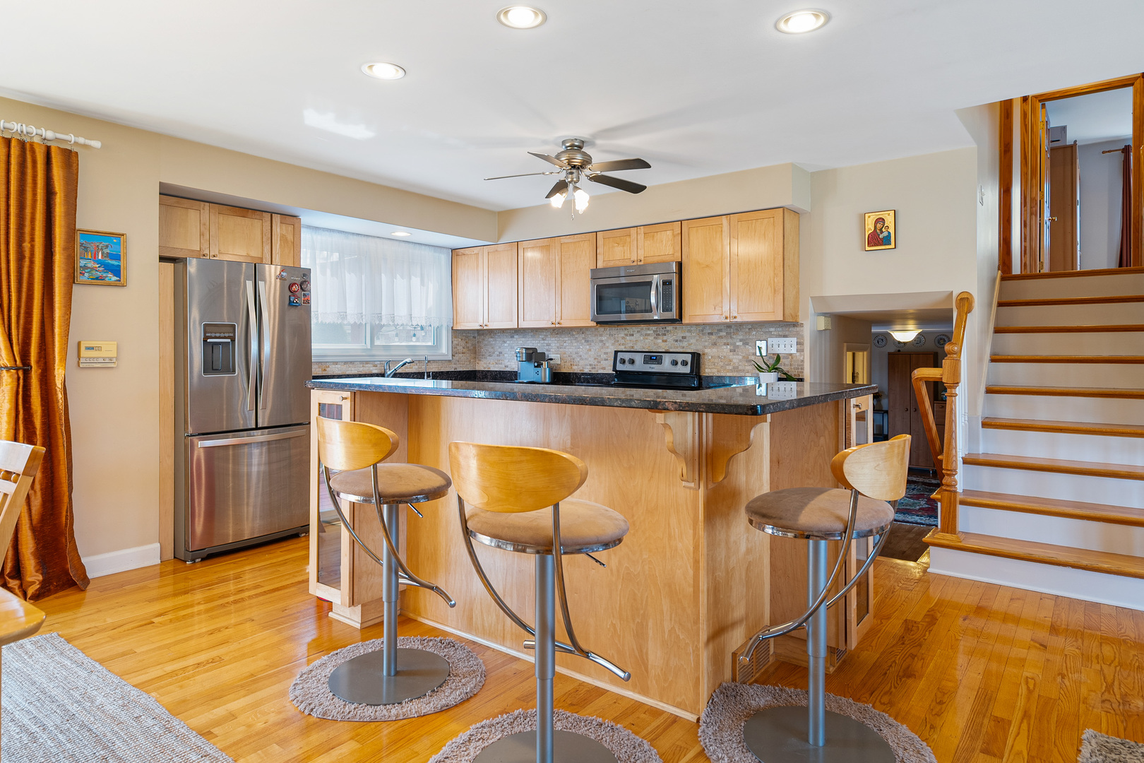 4301 Euclid Avenue Rolling Meadows, IL 60008 - Photo 5 of 30 a kitchen with stainless steel appliances granite countertop a sink a stove a refrigerator cabinets and dining table