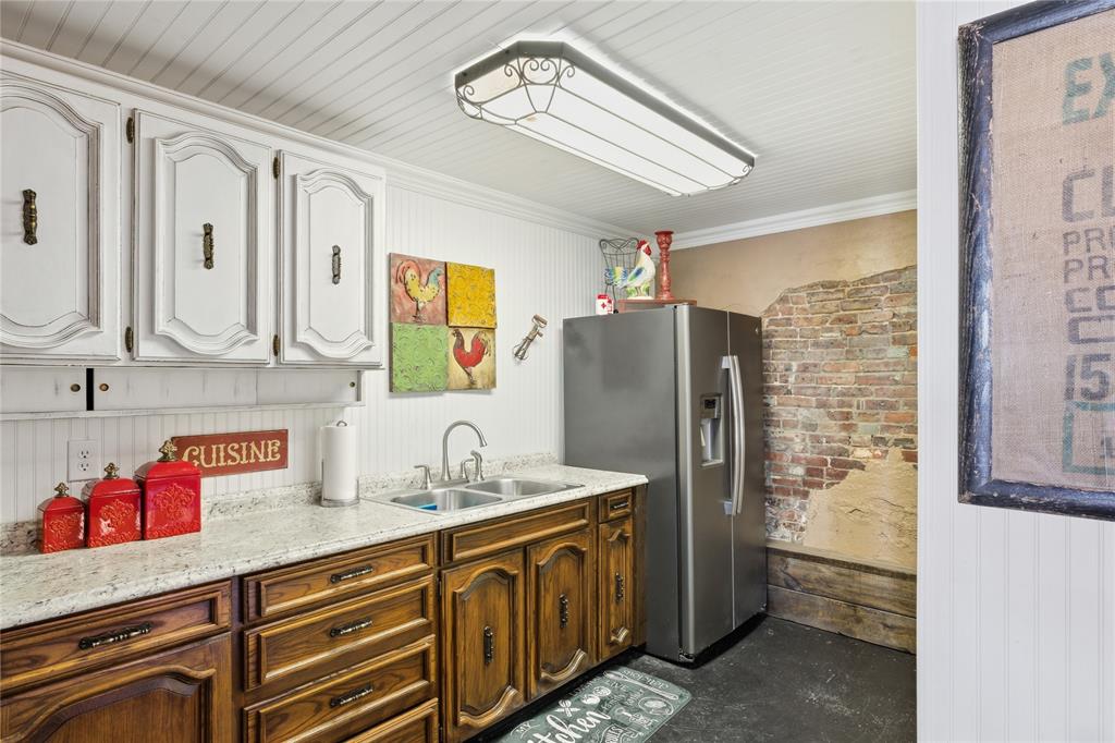 10 Ss Cooper, TX 75432 - Photo 12 of 40 a kitchen with stainless steel appliances a refrigerator and a stove